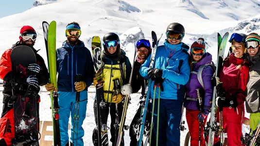 group of skiers and snowboarders