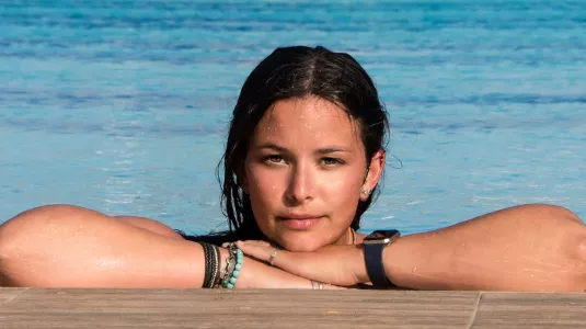 girl relaxing in swimming pool