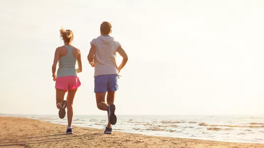 couple running on the beach