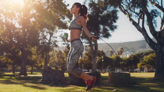 woman skipping in a park