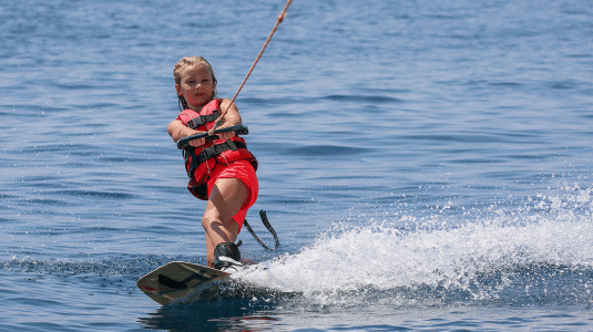 young girl wakeboarding