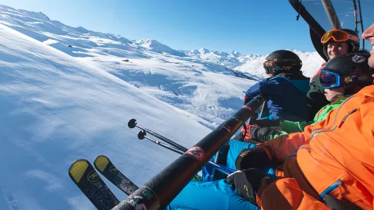 family on a ski lift