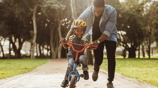 Father and son learning to cycle