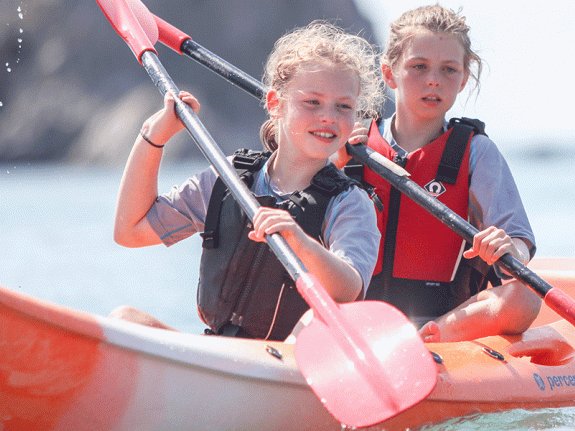 two girls kayaking