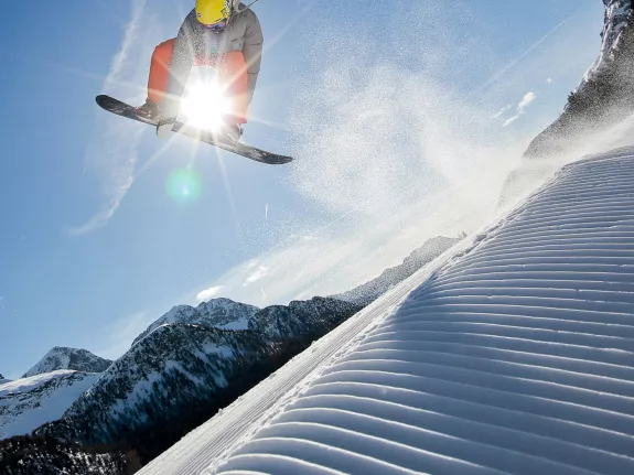 Snowboarder riding in Italy