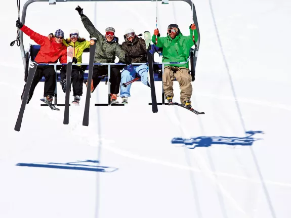 Friends on a ski lift in Andorra