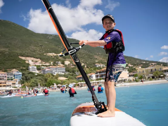 Young boy windsurfing