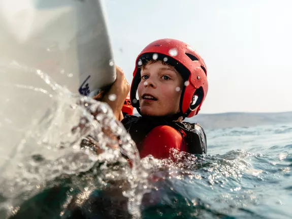 boy dinghy sailing